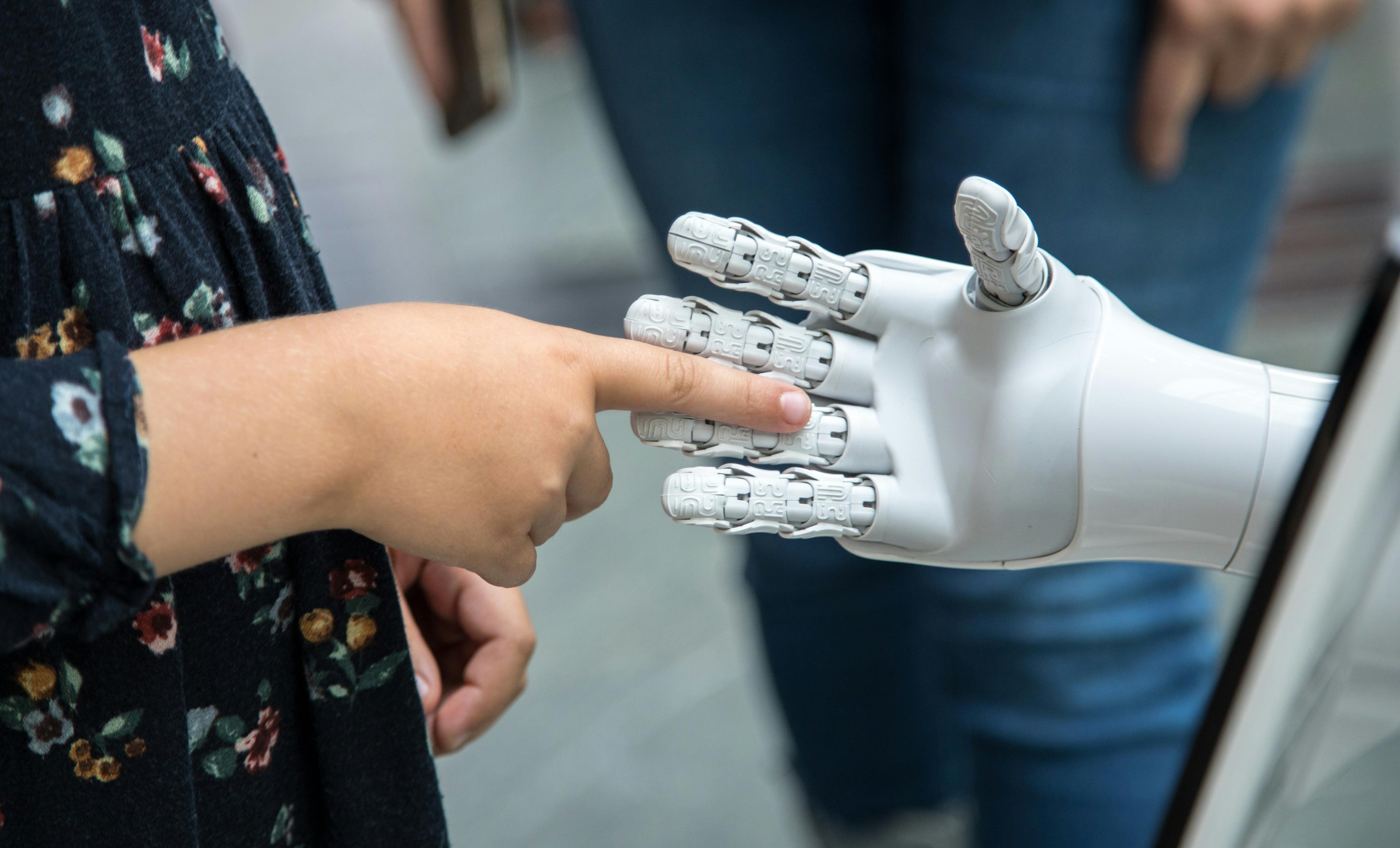 A student making friends with AI and robots