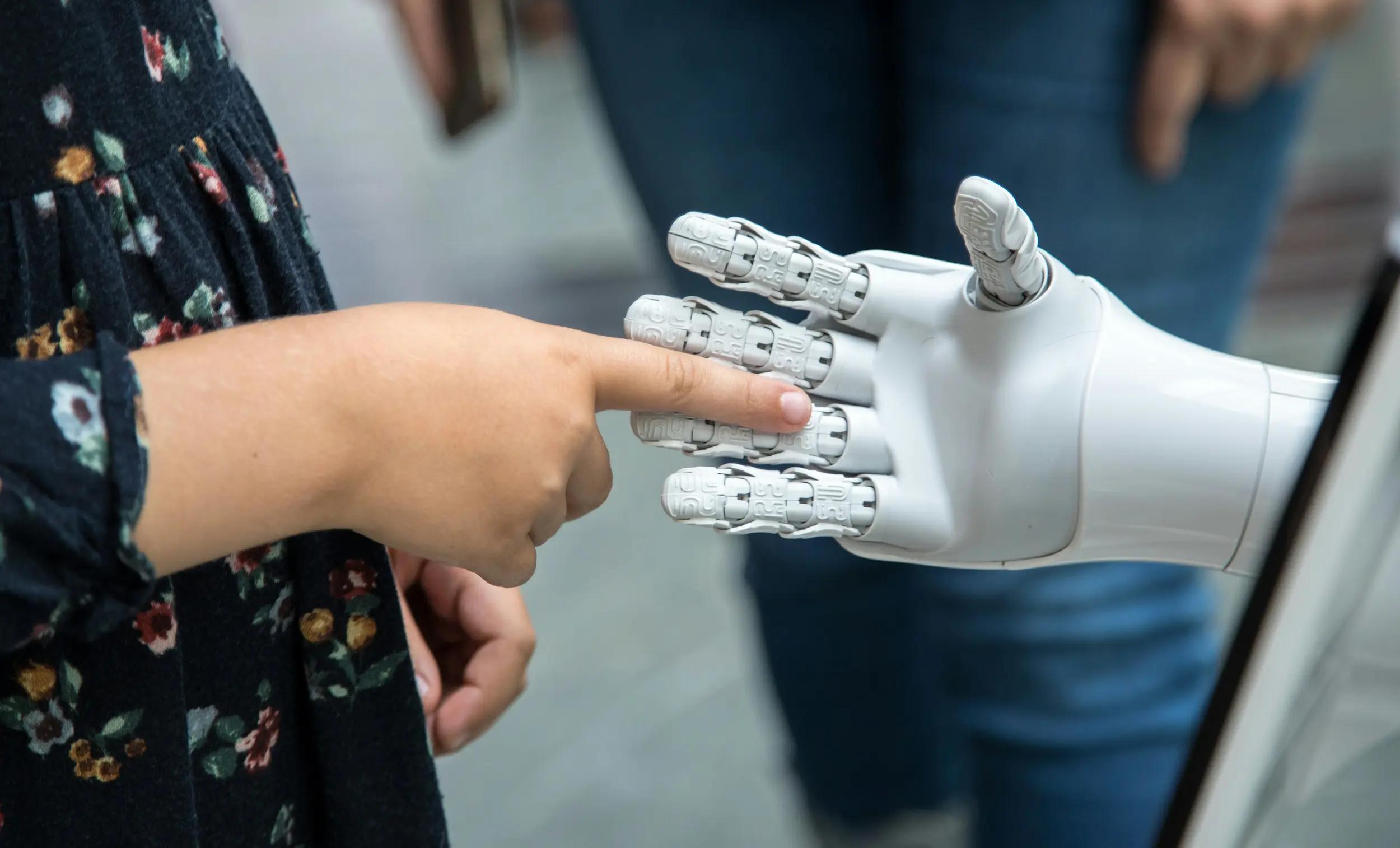 A student making friends with AI and robots