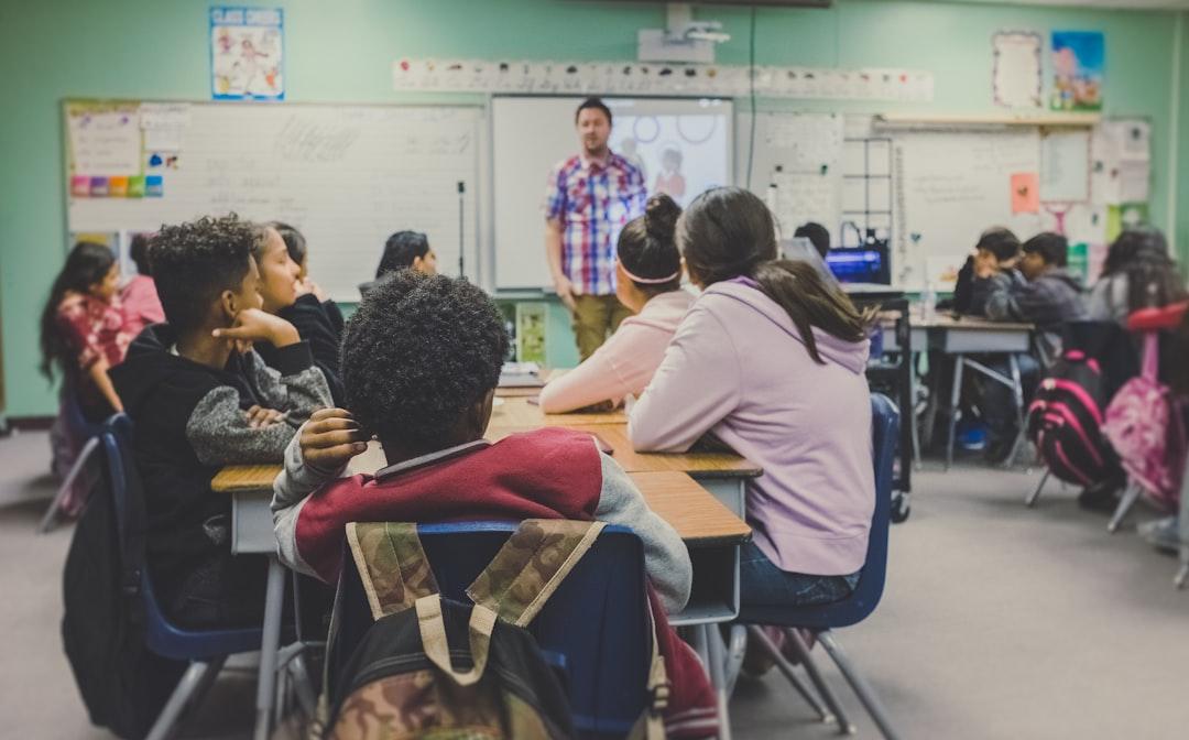 Teacher listening closely as a middle school student explains their reasoning aloud
