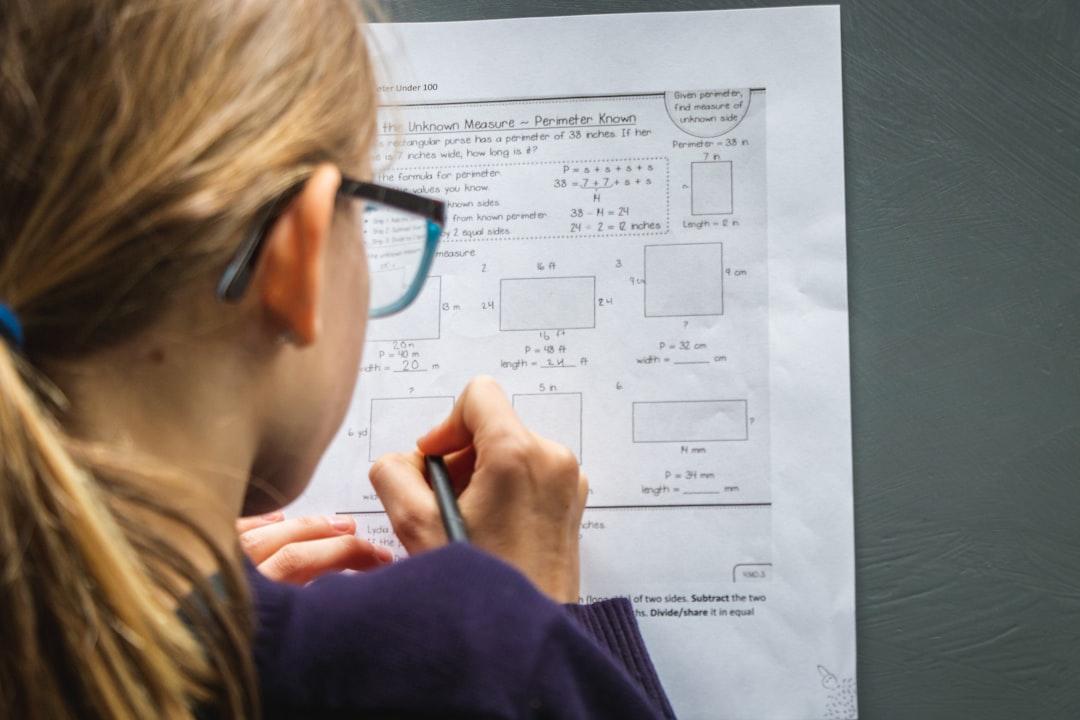 A teacher observing students as they work through a classroom assignment