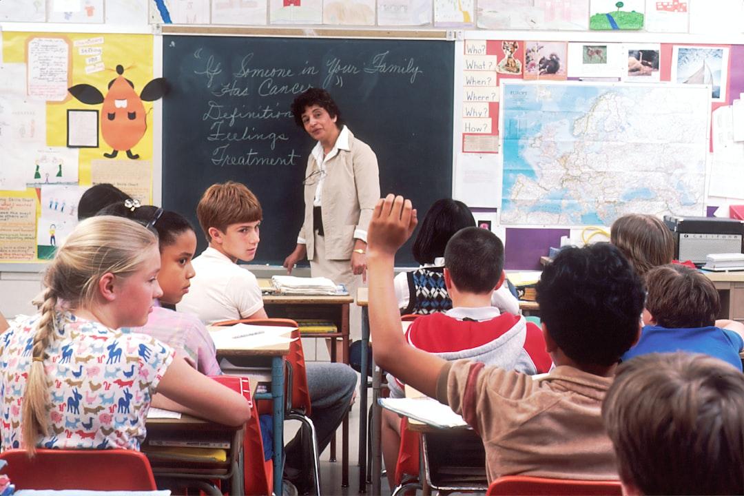 Teacher standing in front of a classroom addressing students